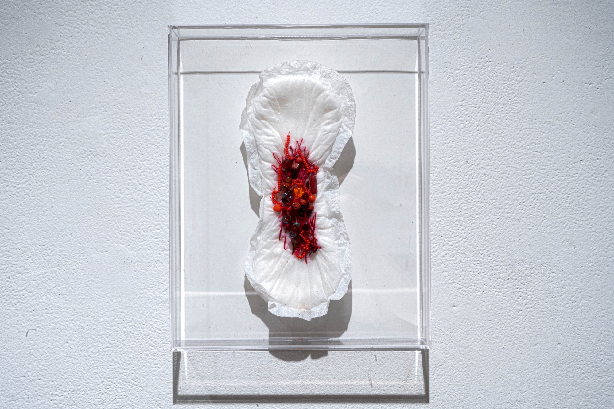 Sculptural work in a glass case