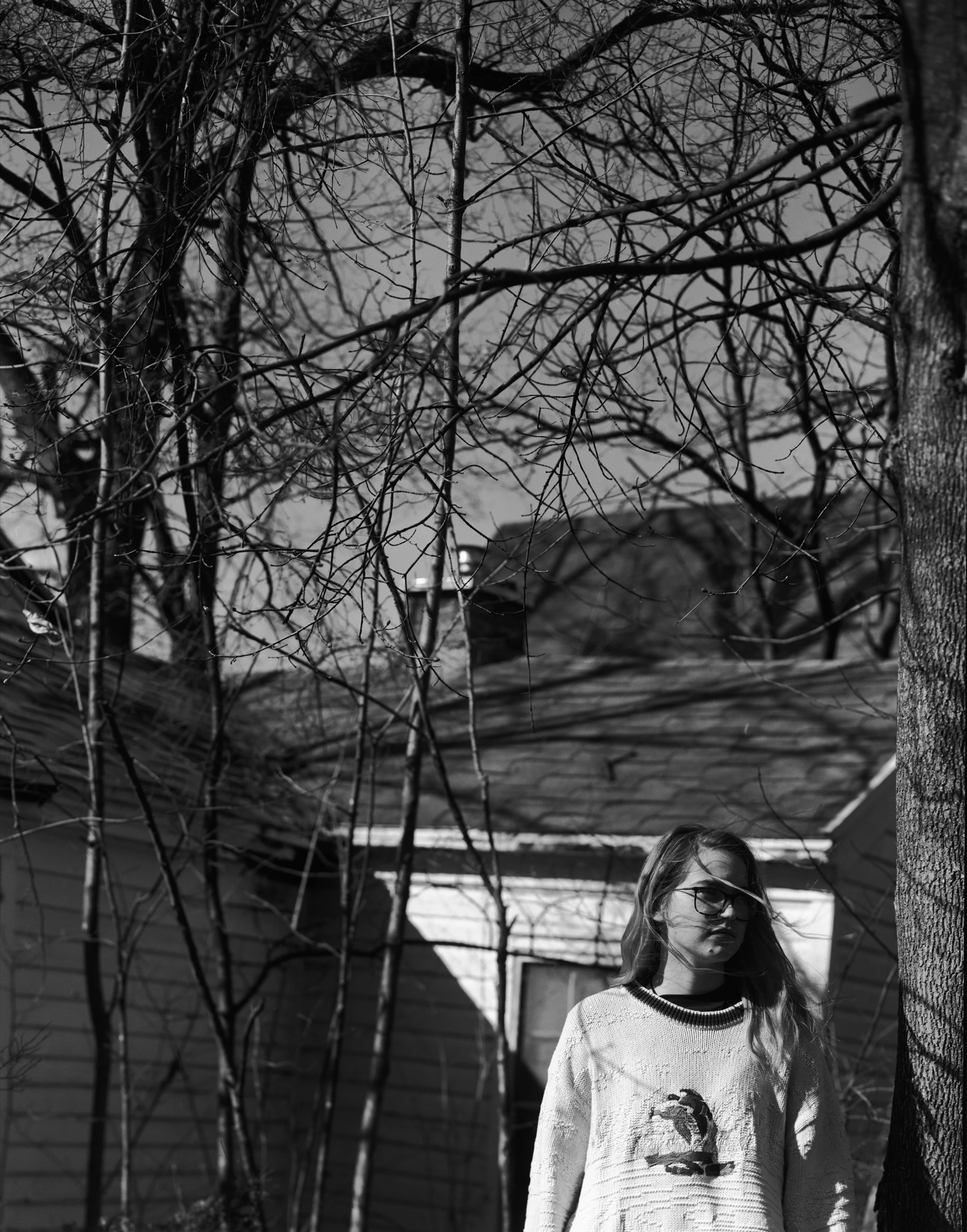 Large-format black-and-white photograph, a figure among trees