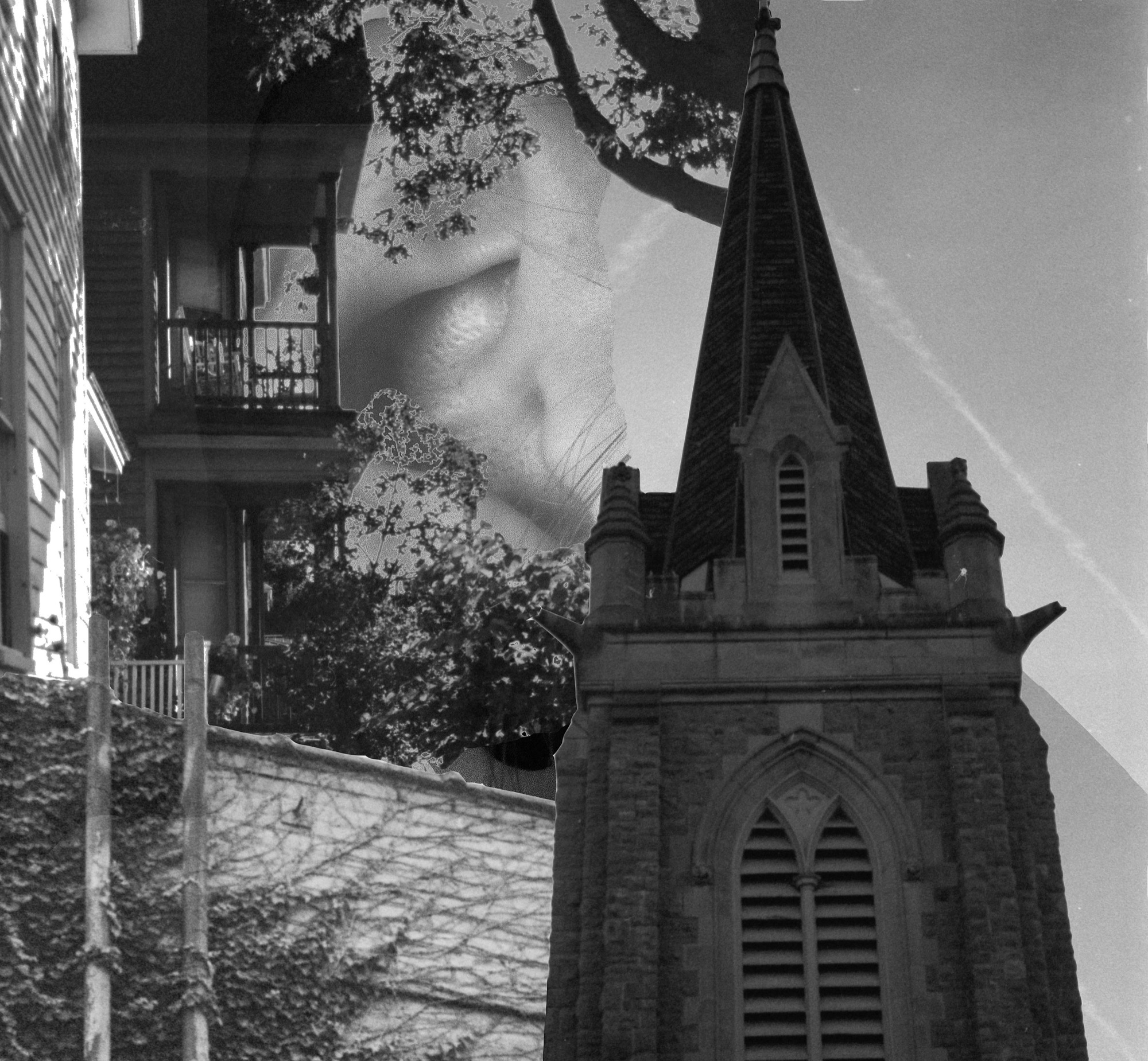 Black-and-white church steeple against a dark sky