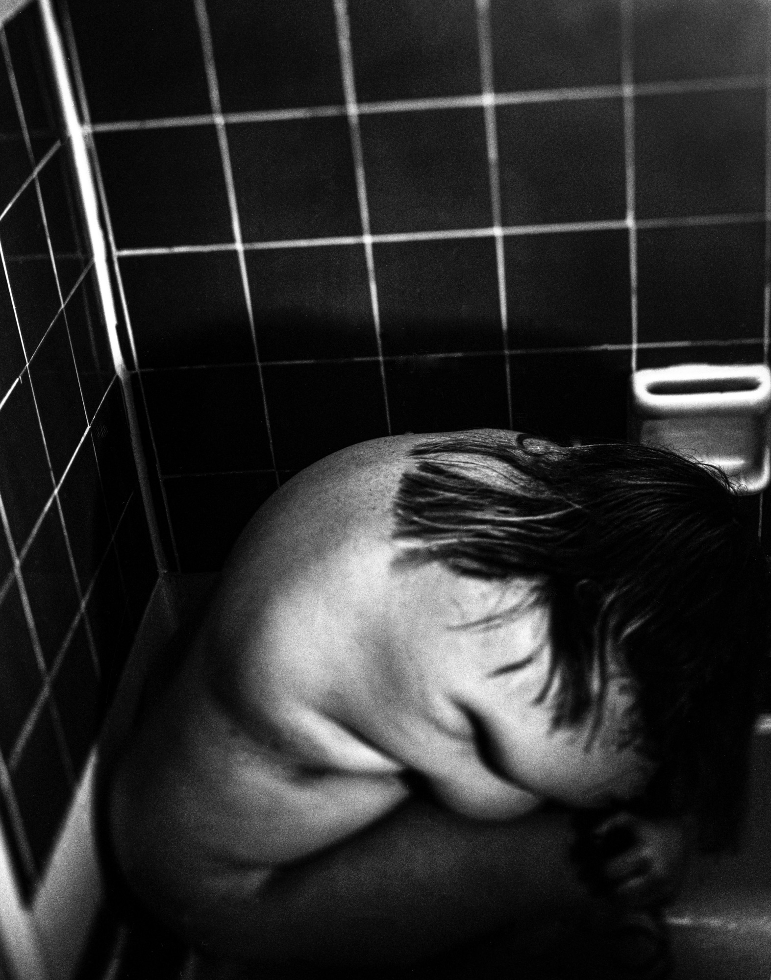 A child in a bath, black and white